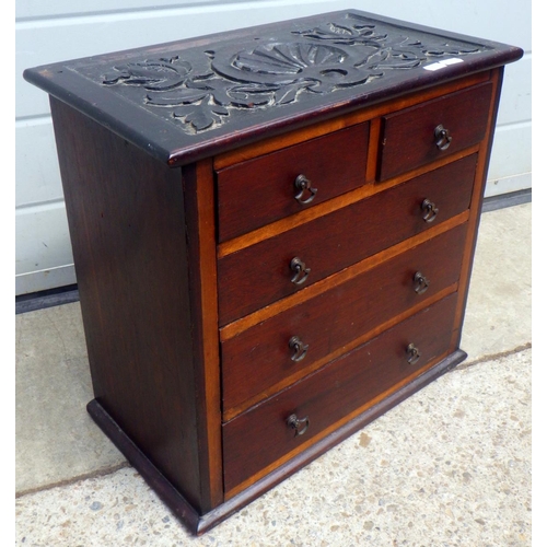 694 - A 19th century miniature chest of drawers with carved top 43 x 40cm