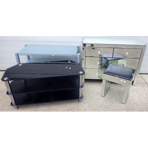 705 - Two glass tv stands together with a mirrored chest (af cracked panels) and a stool (4)