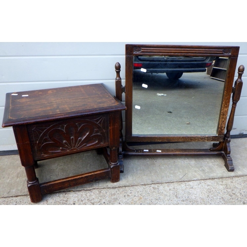 714 - A small carved oak stool with lift up lid together with a dressing mirror (2)