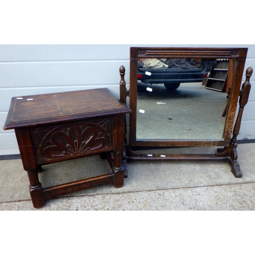 714 - A small carved oak stool with lift up lid together with a dressing mirror (2)