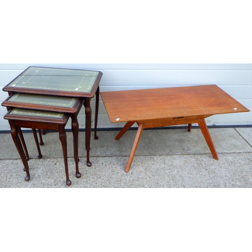 716 - A set of three leather topped nest of tables together with a teak coffee table (2)