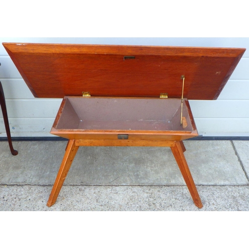 716 - A set of three leather topped nest of tables together with a teak coffee table (2)