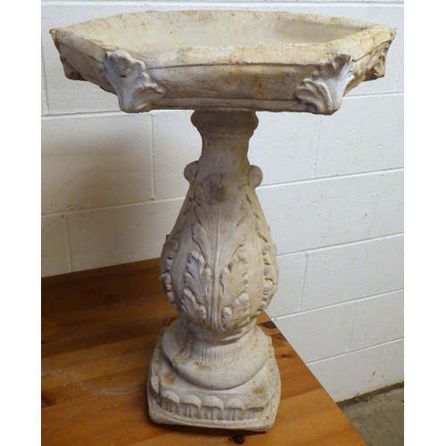 725 - A garden concrete bird bath 66cm tall