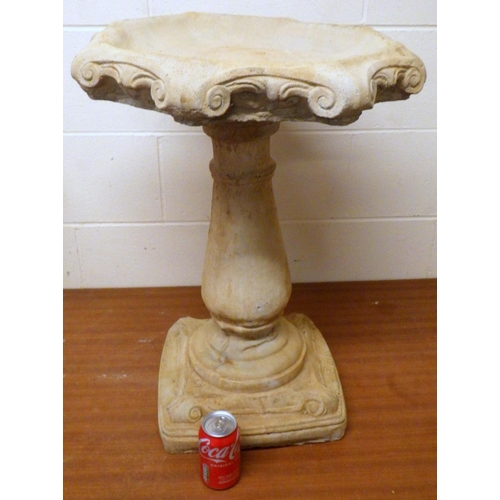 731 - A garden concrete bird bath 65cm tall