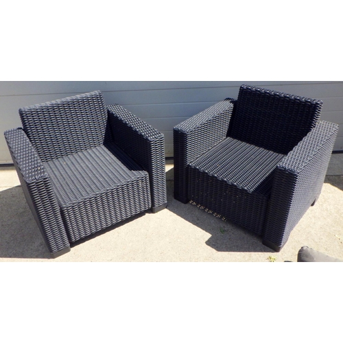 741 - A pair of rattan style garden chairs