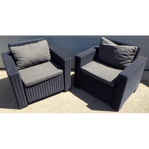 741 - A pair of rattan style garden chairs