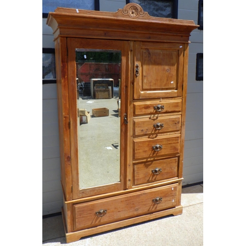 745 - A 19thC stripped pine mirror fronted wardrobe 135cm wide