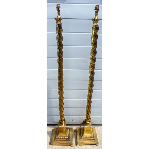 751 - A pair of twisted brass lamp standards