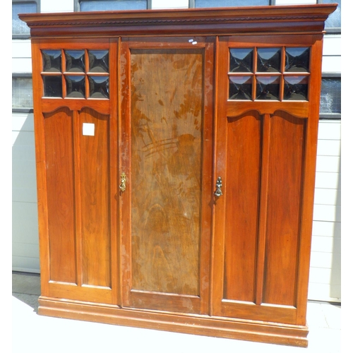 759 - A walnut Arts & Crafts wardrobe 190cm wide
  Ex. York Minster Stores