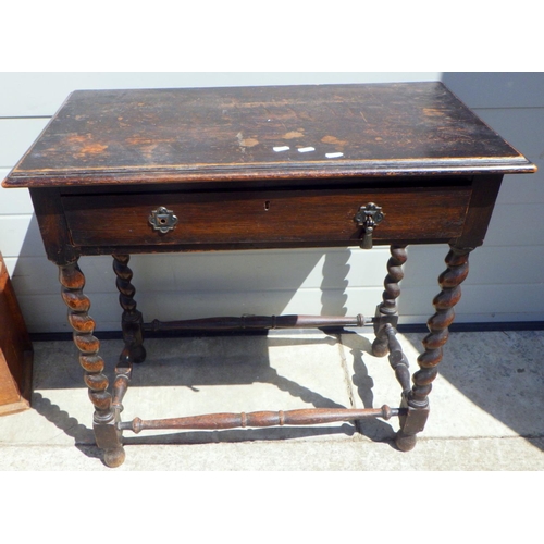 763 - An oak barley twist side table af 75cm wide
  Ex. York Minster Stores