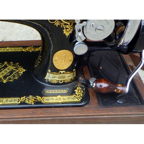 784 - A cased Singer sewing machine