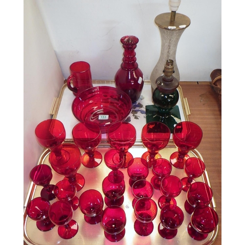 153 - A collection of red glass incl decanters and drinking glasses; two glass table lamp bases. (2)