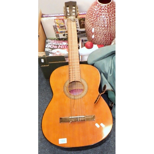 188 - An acoustic guitar, guitar interest books, a vase etc. (2)