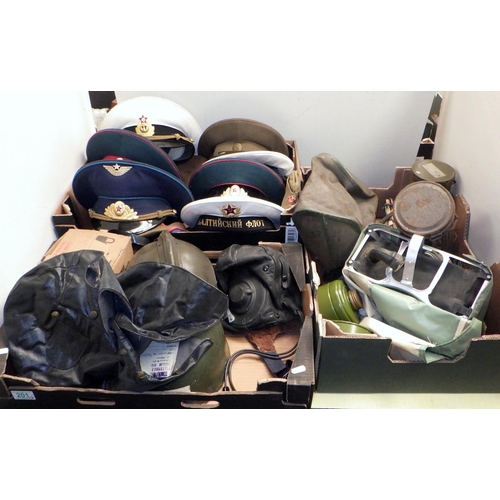 201 - A collection of Soviet era Russian military uniform hats; military helmets, gas masks etc. (3)