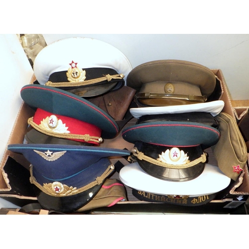 201 - A collection of Soviet era Russian military uniform hats; military helmets, gas masks etc. (3)