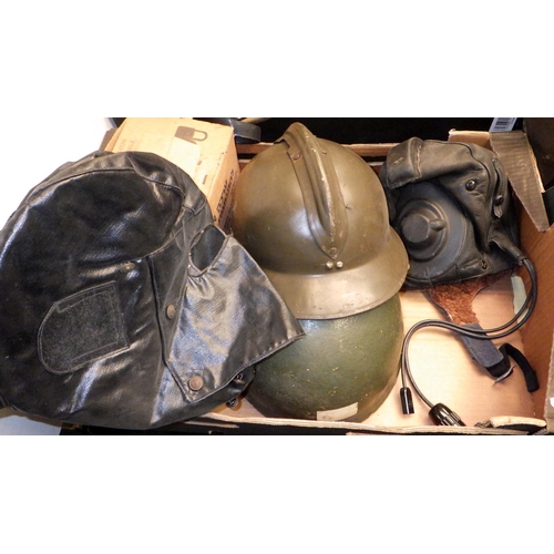 201 - A collection of Soviet era Russian military uniform hats; military helmets, gas masks etc. (3)