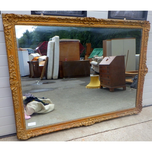 821 - A large 19thC gilt framed mirror, overpainted 140 x 190cm with paper label D.J McLauchlan, Blackfria... 