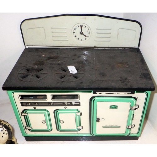 235 - A Mettoy tinplate toy range oven, other tinplate incl Sooty interest and toy chocolate dispensers.  ... 