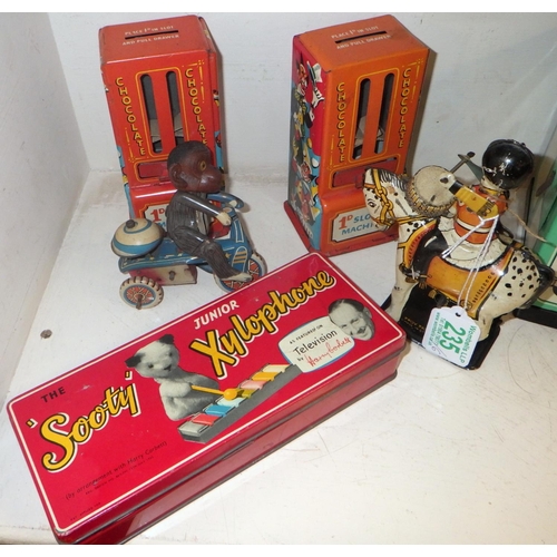 235 - A Mettoy tinplate toy range oven, other tinplate incl Sooty interest and toy chocolate dispensers.  ... 