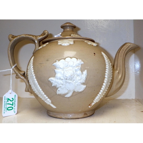 270 - A teapot in drabware stoneware having sprig decoration and bearing impressed wording 