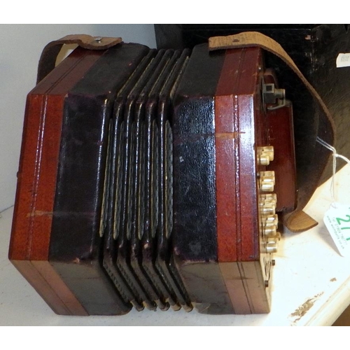 271 - A concertina.  A/F old restoration, lacking name plate.  Cased.