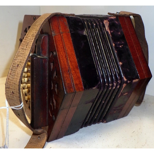 271 - A concertina.  A/F old restoration, lacking name plate.  Cased.