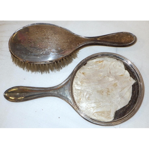 292 - Silver: sugar sifter spoon, IB London 1800; a hand mirror back; a hair brush; a christening mug 