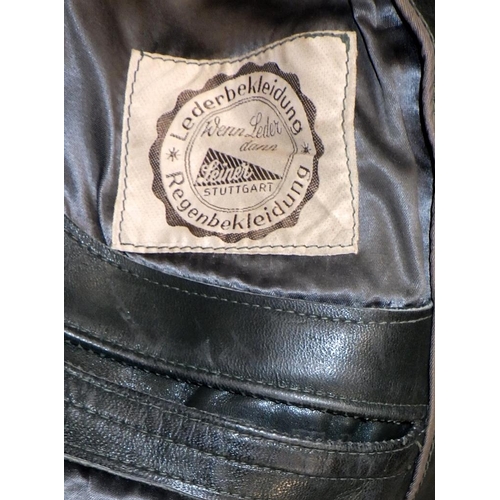 297 - A German grey / green leather greatcoat in WW2 German military manner, bearing a label 