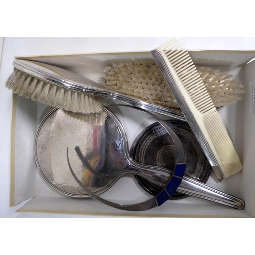 300 - A four piece brush set, white metal marked 925; a torque collar necklace, white metal and enamel mar... 