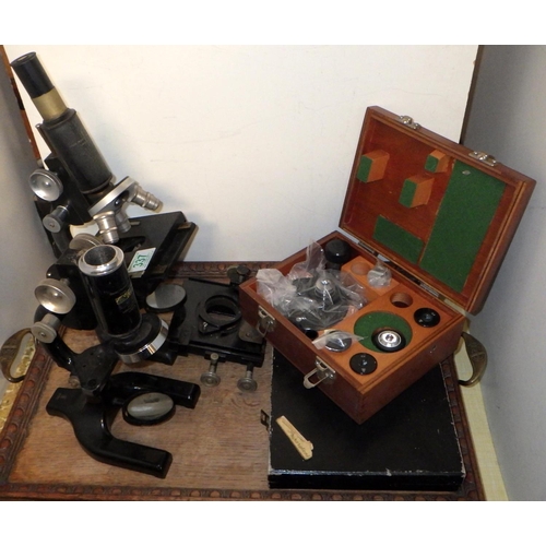 337 - Two Cooke Troughton and Simms, York microscopes, both a/f; a case of microscope slides, etc; present... 