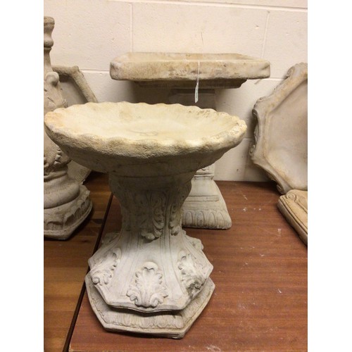 730 - A garden concrete bird bath 50cm tall together with a small bird bath (2)