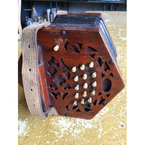 271 - A concertina.  A/F old restoration, lacking name plate.  Cased.