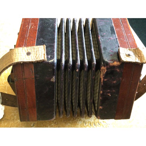 271 - A concertina.  A/F old restoration, lacking name plate.  Cased.