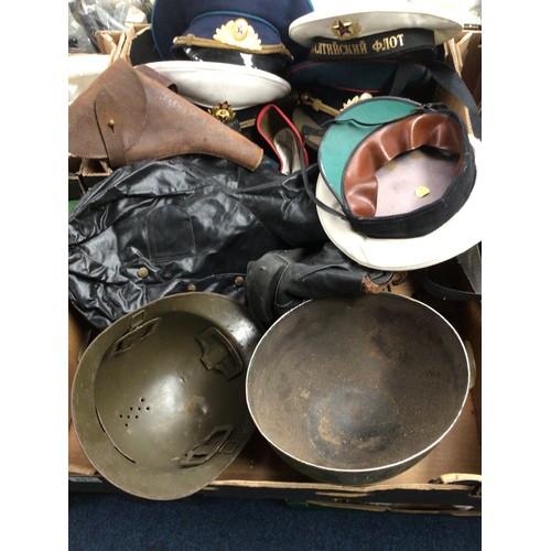 201 - A collection of Soviet era Russian military uniform hats; military helmets, gas masks etc. (3)