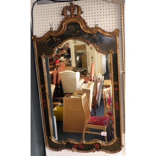 186 - An oriental design bevelled mirror 60cm x 110 cm