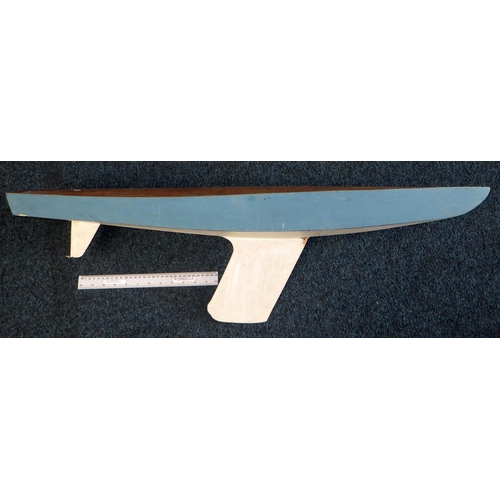 196 - A model boat keel painted blue and white. Length 99cm.