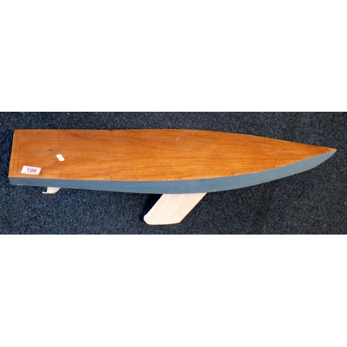 196 - A model boat keel painted blue and white. Length 99cm.