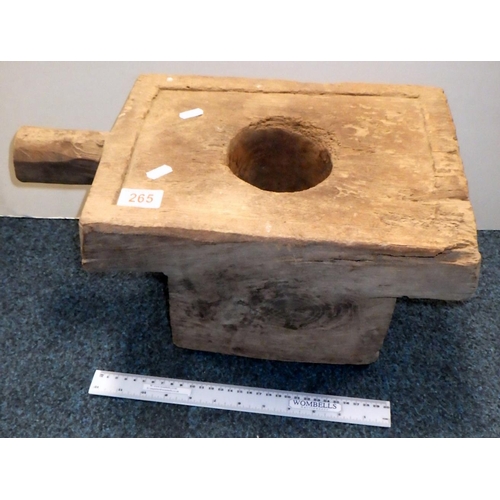 265 - Wooden block with handle and hole.