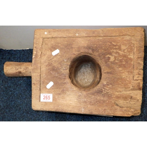 265 - Wooden block with handle and hole.