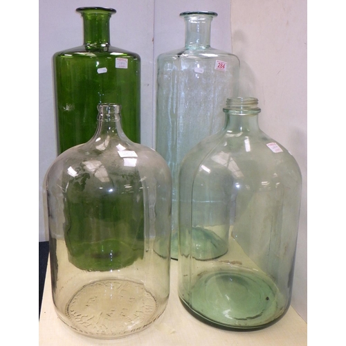 284 - Two large 23 litre bottles made in Mexico together with two other large containers 75cm tall (4)