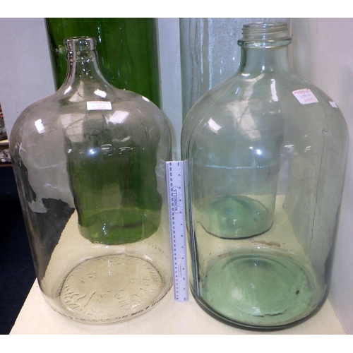 284 - Two large 23 litre bottles made in Mexico together with two other large containers 75cm tall (4)