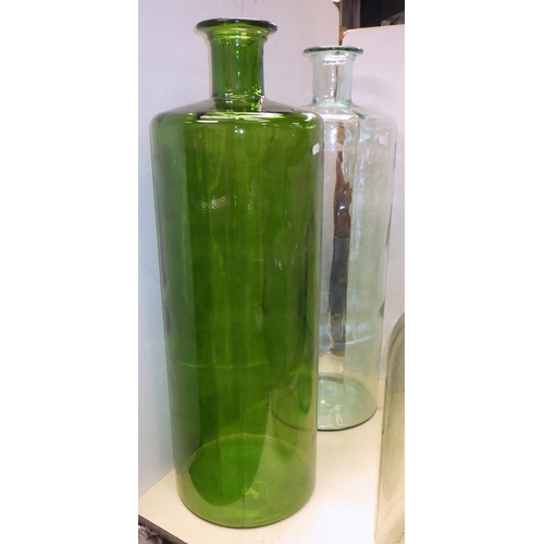 284 - Two large 23 litre bottles made in Mexico together with two other large containers 75cm tall (4)