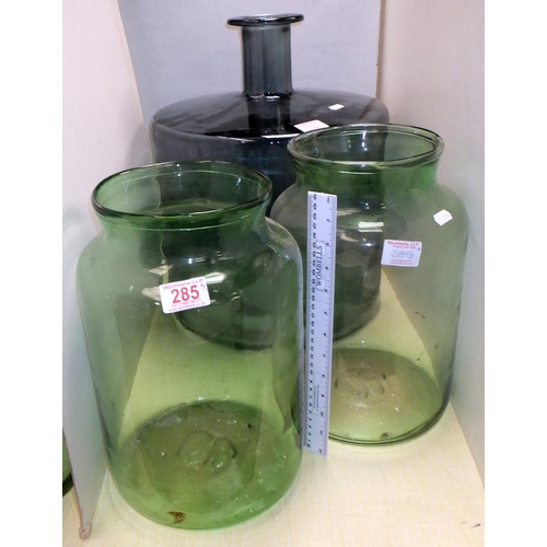 285 - A pair of large green jars together with a large squat bottle 45cm tall