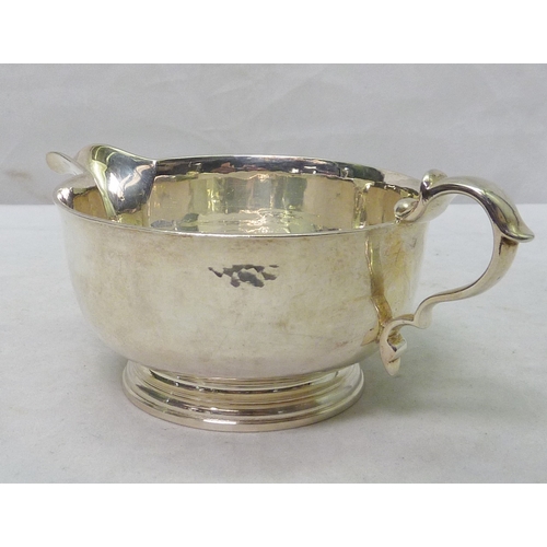14 - An Art Deco silver jug having planished finish, C Shapland & Co, London 1934.  160mm long / 260g