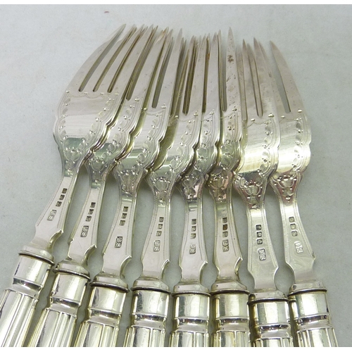 24 - A part canteen of fish cutlery comprising eight matching knives and forks, the prongs and blades sil... 