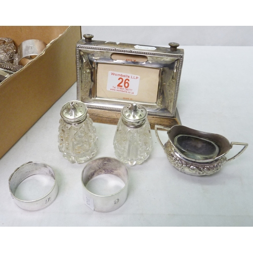 26 - A silver fronted perpetual desk calendar, a/f; silver incl two numbered napkin rings and manicure se... 