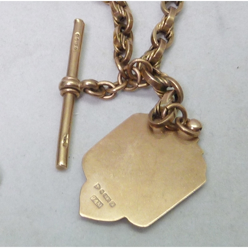 32 - A fancy link watch chain, unmarked yellow metal having attached 9ct gold fob and 9ct gold T bar; a s... 