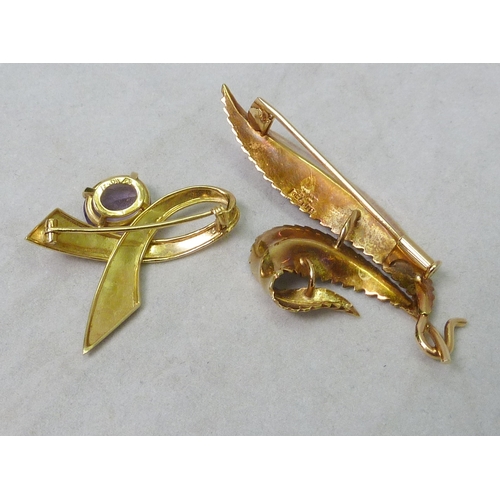 61 - A leaf-shaped brooch, yellow metal marked 750 Industria Argentina, 61mm across; a ribbon twist brooc... 