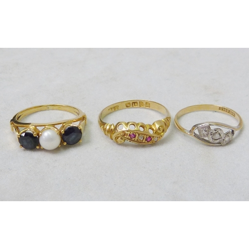 65 - A trilogy ring, unmarked yellow metal set with a pearl and synthetic stone; an early 20th cent 18ct ... 