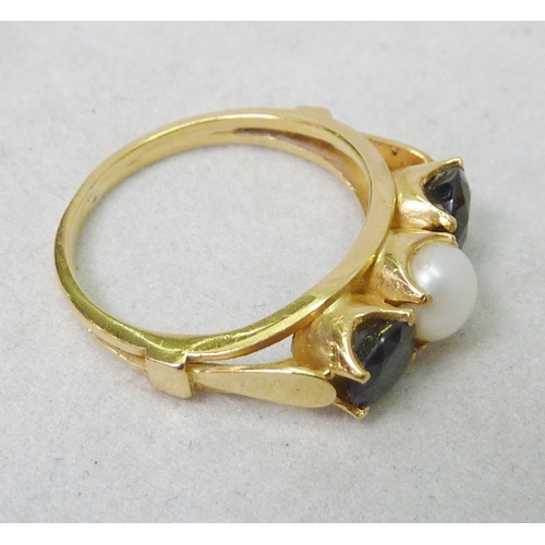 65 - A trilogy ring, unmarked yellow metal set with a pearl and synthetic stone; an early 20th cent 18ct ... 